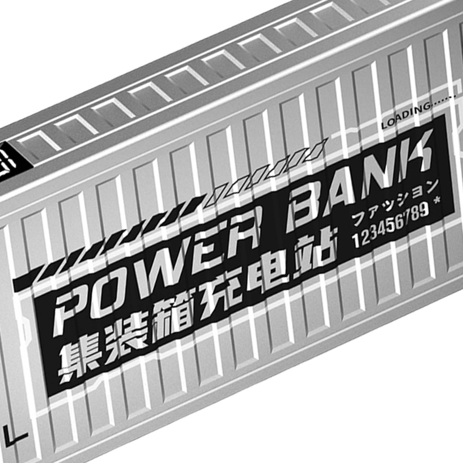 Une batterie externe argentée avec les mots 'POWER BANK' en grandes lettres sur fond noir, avec des caractères japonais.