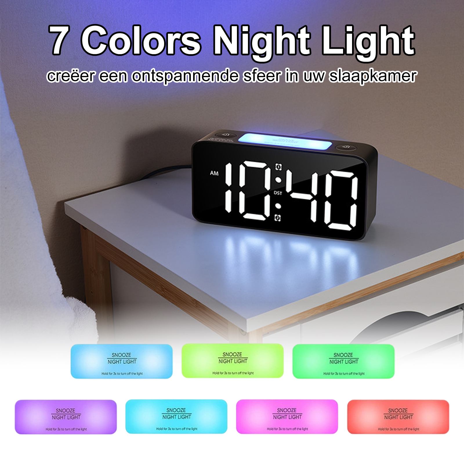 Eine schwarze Digitaluhr auf einem weißen Nachttisch. Die Uhr zeigt 10:40 Uhr an. Darunter befinden sich mehrere farbige Tasten.