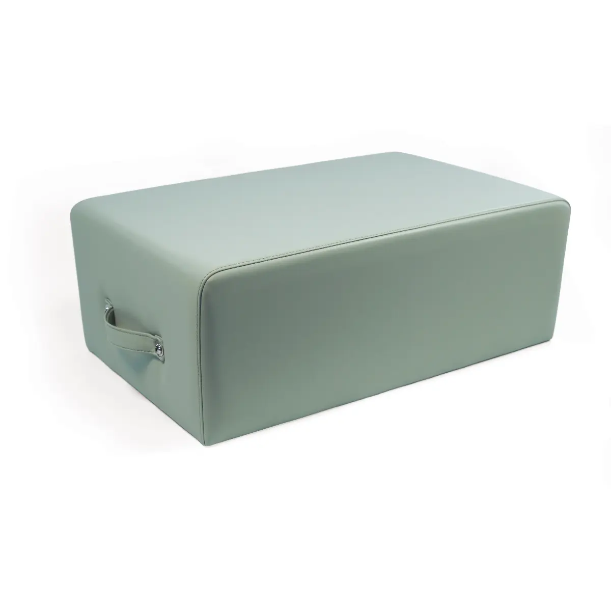 A rectangular, light-green pilates box with a handle on the side. It sits on a white background.