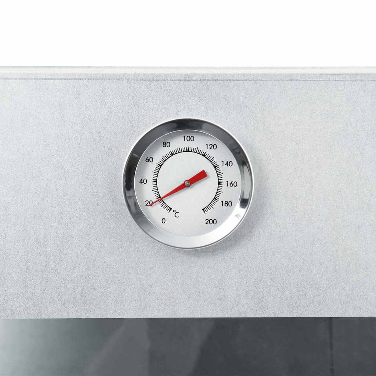 Ein silbernes Ofenthermometer zeigt 40 Grad Celsius an. Der Hintergrund ist eine hellgraue Oberfläche.