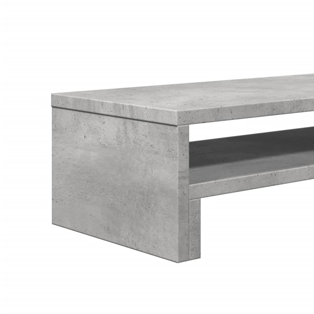 Ein grauer TV-Ständer aus Beton. Er hat eine rechteckige Form mit einem Regal unter der oberen Oberfläche. Der Hintergrund ist weiß.
