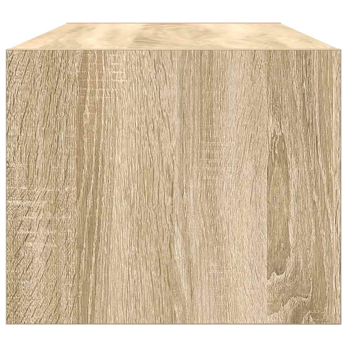 Nahaufnahme eines Holzblocks. Das Holz hat eine hellbraune Farbe und ein sichtbares Maserungsmuster. Die Oberseite ist heller.
