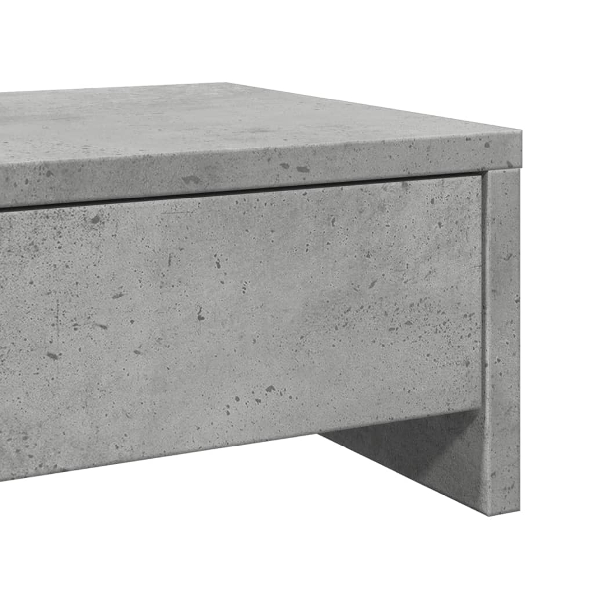 Nahaufnahme eines grauen Beton-Schranks. Der Schrank hat eine Schublade und ein Stützbein auf der rechten Seite. Weißer Hintergrund.