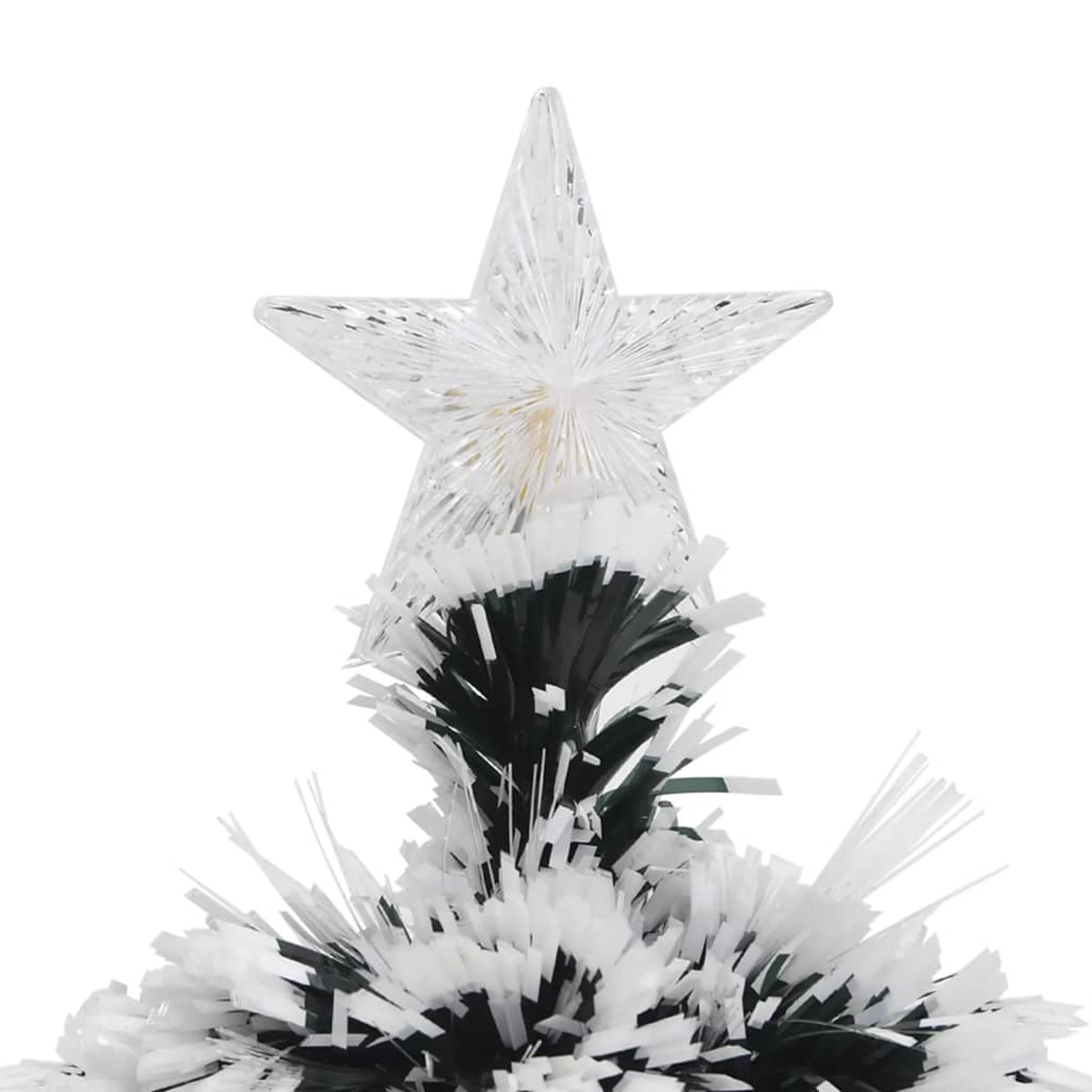 Eine Weihnachtsbaumspitze mit einem sternförmigen, durchsichtigen Ornament. Der Baum hat weiße und schwarze Nadeln.