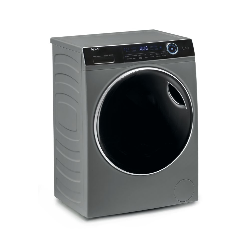 Una lavadora gris Haier. Tiene una puerta negra y una pantalla digital. La máquina está sobre una superficie blanca.