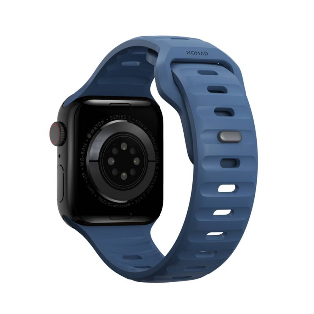 Un Apple Watch azul con una correa a juego. La esfera del reloj es negra. La correa dice Nomad.