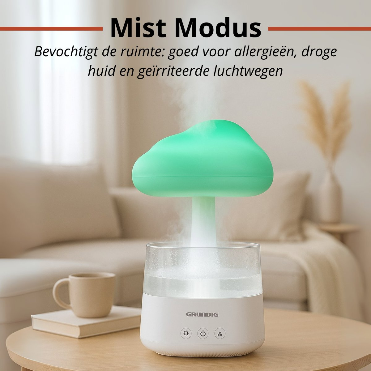 A white Grundig humidifier with a green top, releasing mist. A cup and book sit beside it on a wooden table. Text: Mist Modus.