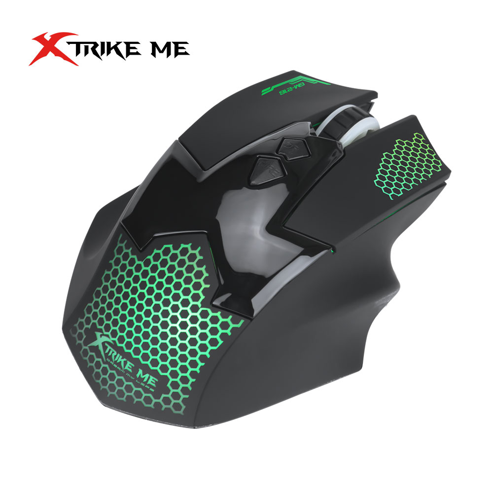 Un ratón gaming X-Trike Me negro con patrón de panal verde y logotipo. Tiene botones y una rueda de desplazamiento.