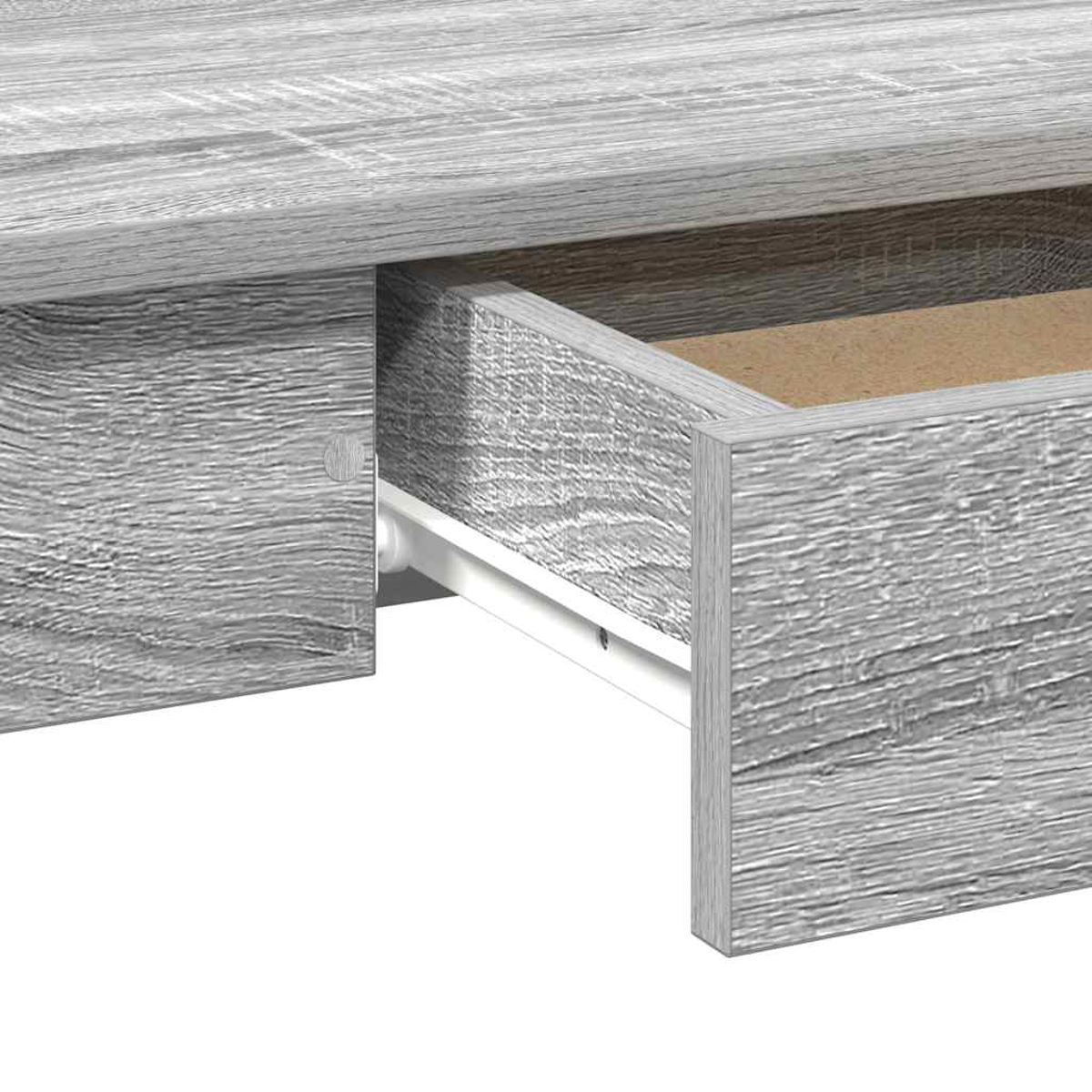 Nahaufnahme einer grauen Holzschreibtischschublade, die teilweise geöffnet ist und das Innere und eine weiße Schiene zeigt. Die Holzmaserung ist sichtbar.