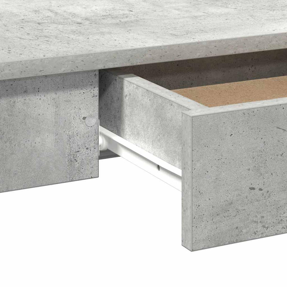 Nahaufnahme einer offenen Betonschublade. Die Schublade ist grau mit Holzinnenraum. Eine weiße Schiene ist sichtbar.
