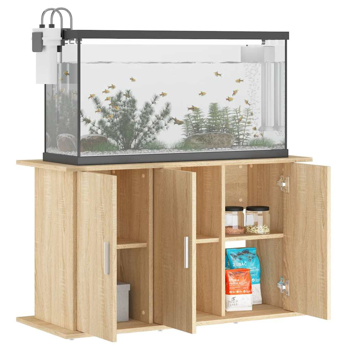 Ein Aquarium mit Fischen, Pflanzen und Steinen steht auf einem Holzschrank mit offenen Türen. Futter und Gläser sind sichtbar.