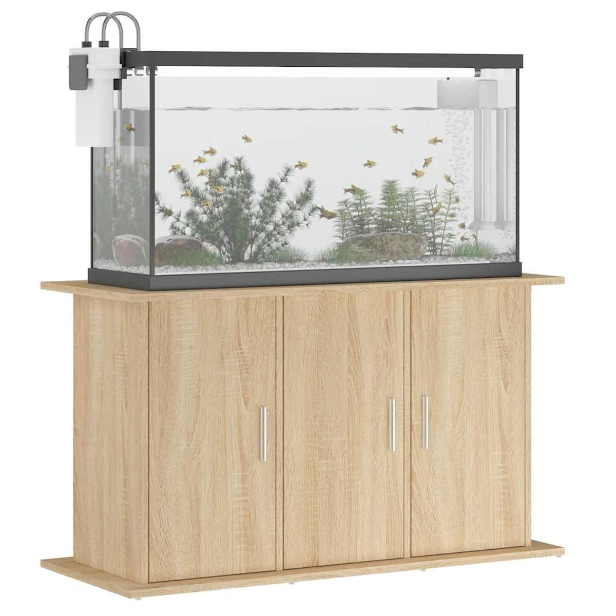 Ein Aquarium steht auf einem Holzschrank. Darin schwimmen Fische um Pflanzen und Steine. Filter sind angebracht.