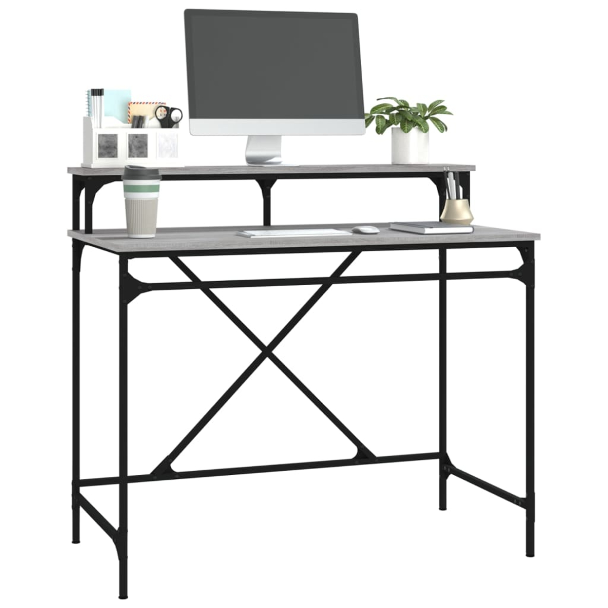 Ein Computertisch mit Monitor, Tastatur, Maus, Stiften und einer Pflanze. Der Tisch hat ein schwarzes Gestell und eine graue Platte.