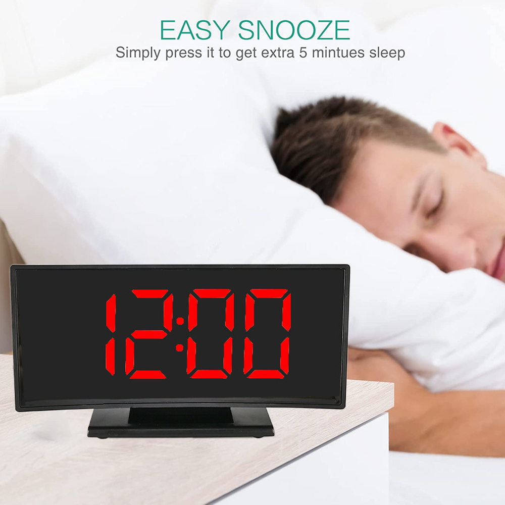 Eine Digitaluhr zeigt 12:00 rot an. Daneben schläft ein Mann. Der Text oben lautet: "EASY SNOOZE".
