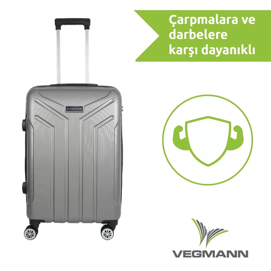 Beyaz zemin üzerinde gri bir Vegmann bavul, tutacağı var. Yeşil metin ve bir kalkan simgesi de mevcut.