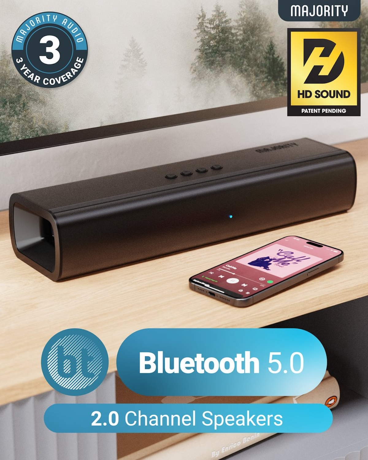 Black speaker with phone displaying music on a wooden surface. Bluetooth 5.0 and 2.0 channel speakers are advertised. HD sound logo.