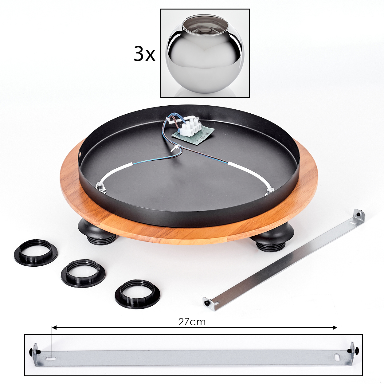 Komponenten einer Lampe: eine schwarze kreisförmige Basis, Holzring, metallische Kugel, schwarze Ringe, ein Metallstab und elektrische Komponenten.
