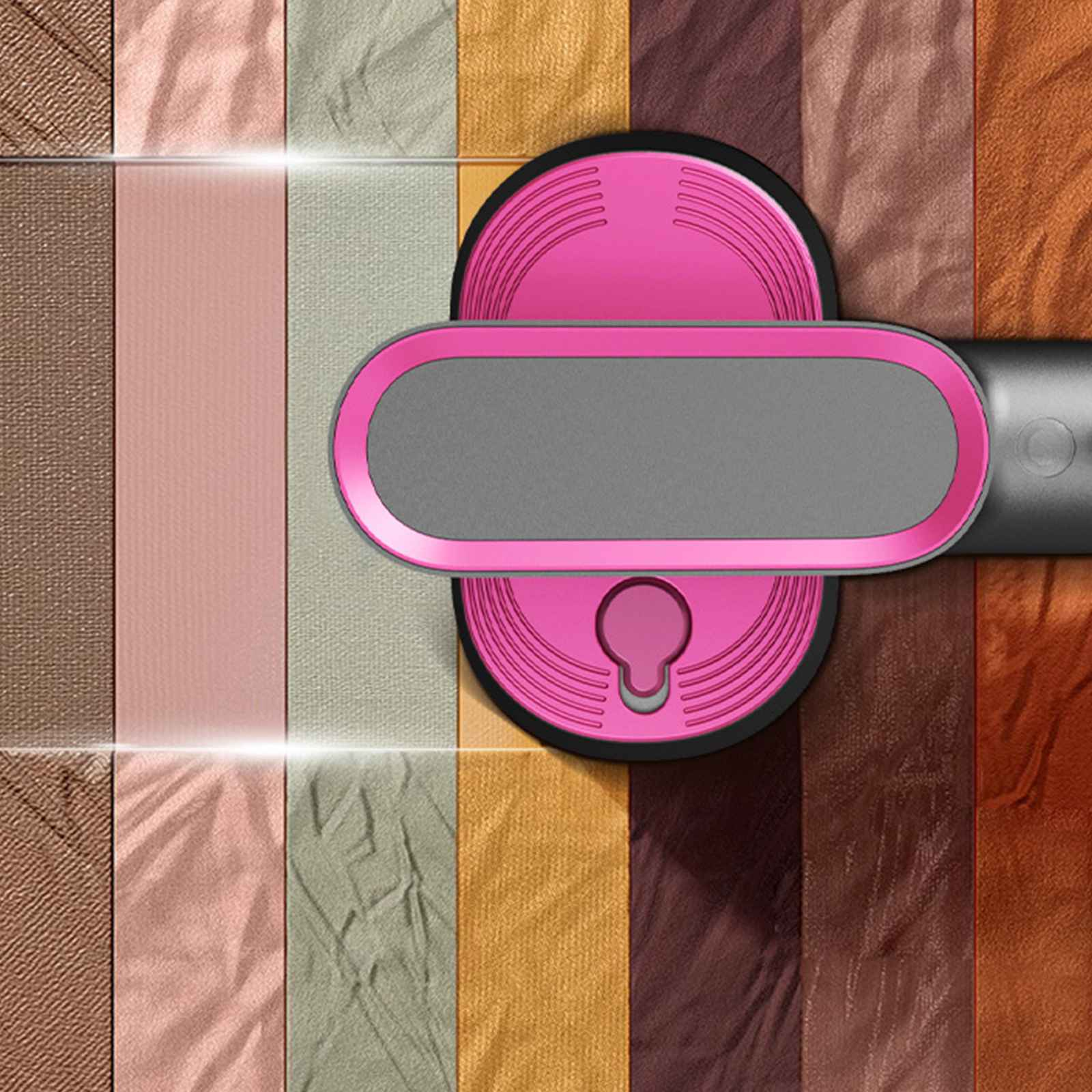 Rosa-graues Gerät über Stoffmustern in verschiedenen Farben. Das Gerät hat ein Schlüsselloch-Design.