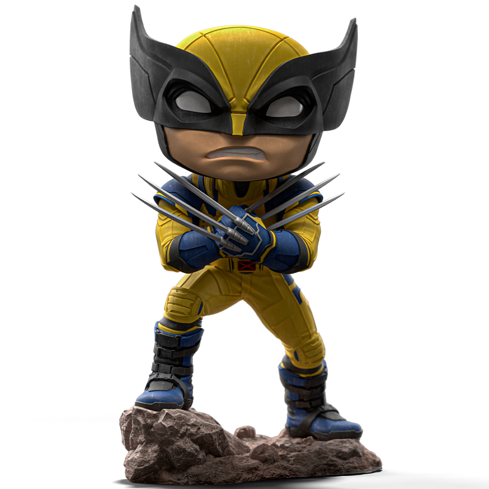 Una statuetta di Wolverine in costume giallo e blu su una base rocciosa. Ha artigli e una maschera nera, pronto all'azione.