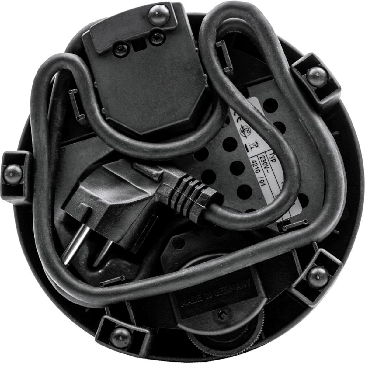 Base nera per apparecchi elettrici con spina, cavo ed etichetta. Visibile "Made in Germany".