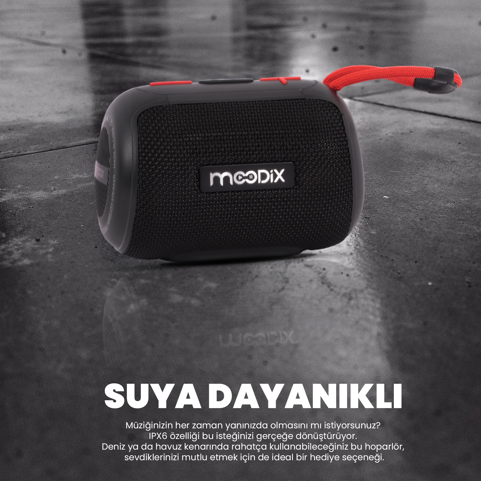 Kırmızı detaylara ve kırmızı kayışa sahip siyah hoparlör. 'mooDIX' markasını taşıyor ve suya dayanıklı.