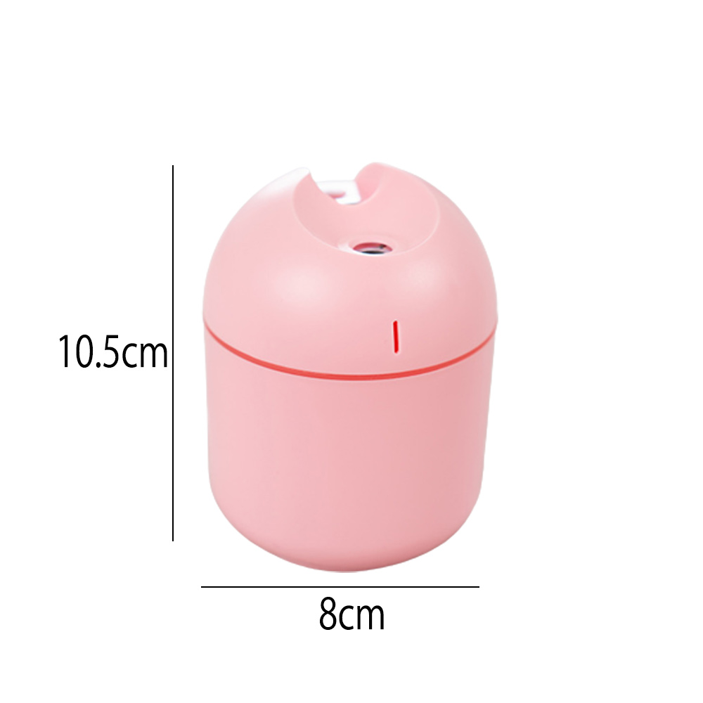 Ein rosa Luftbefeuchter. Das Gerät ist zylindrisch mit abgerundeter Oberseite. Maße: 10,5 cm hoch, 8 cm breit. Es befindet sich auf weißem Hintergrund.