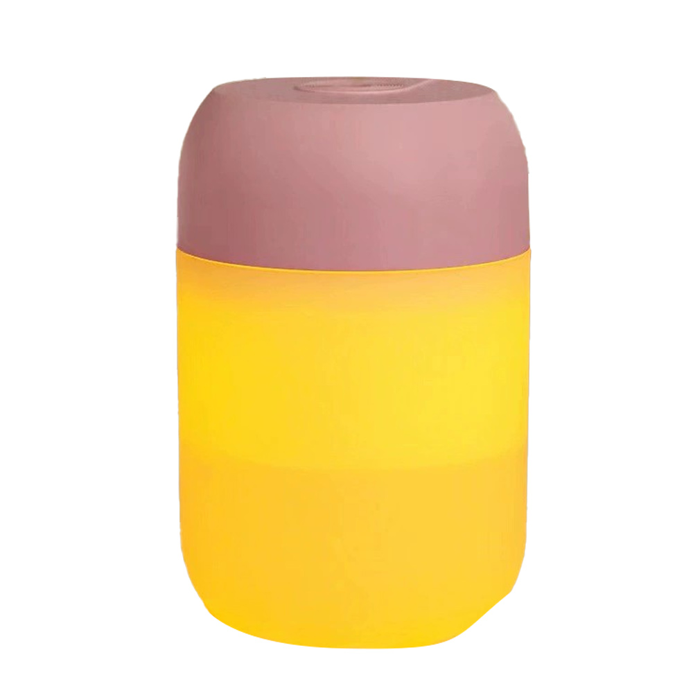 Ein zylindrisches Objekt mit rosafarbenem Deckel und gelbem Körper. Das Objekt ist wahrscheinlich ein Behälter oder eine Lampe.