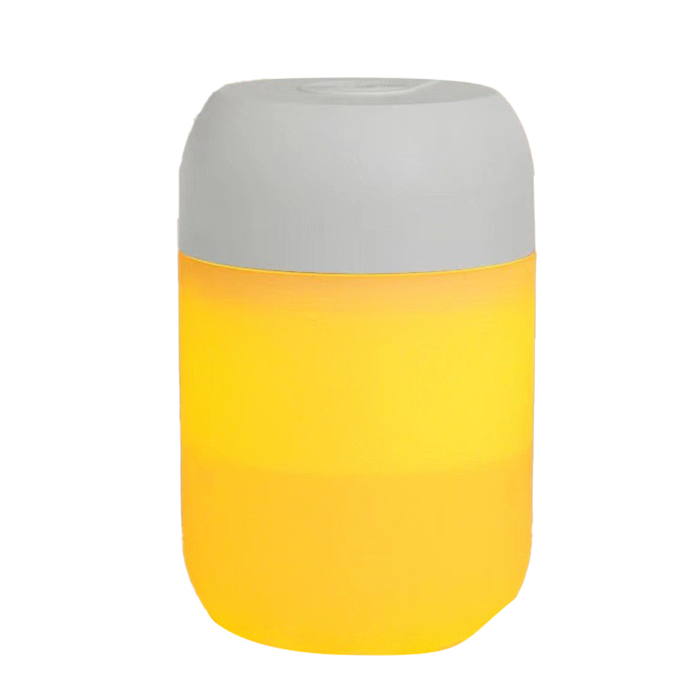 Eine zylindrische Lampe mit grauem Oberteil und gelbem Sockel. Die Lampe leuchtet.