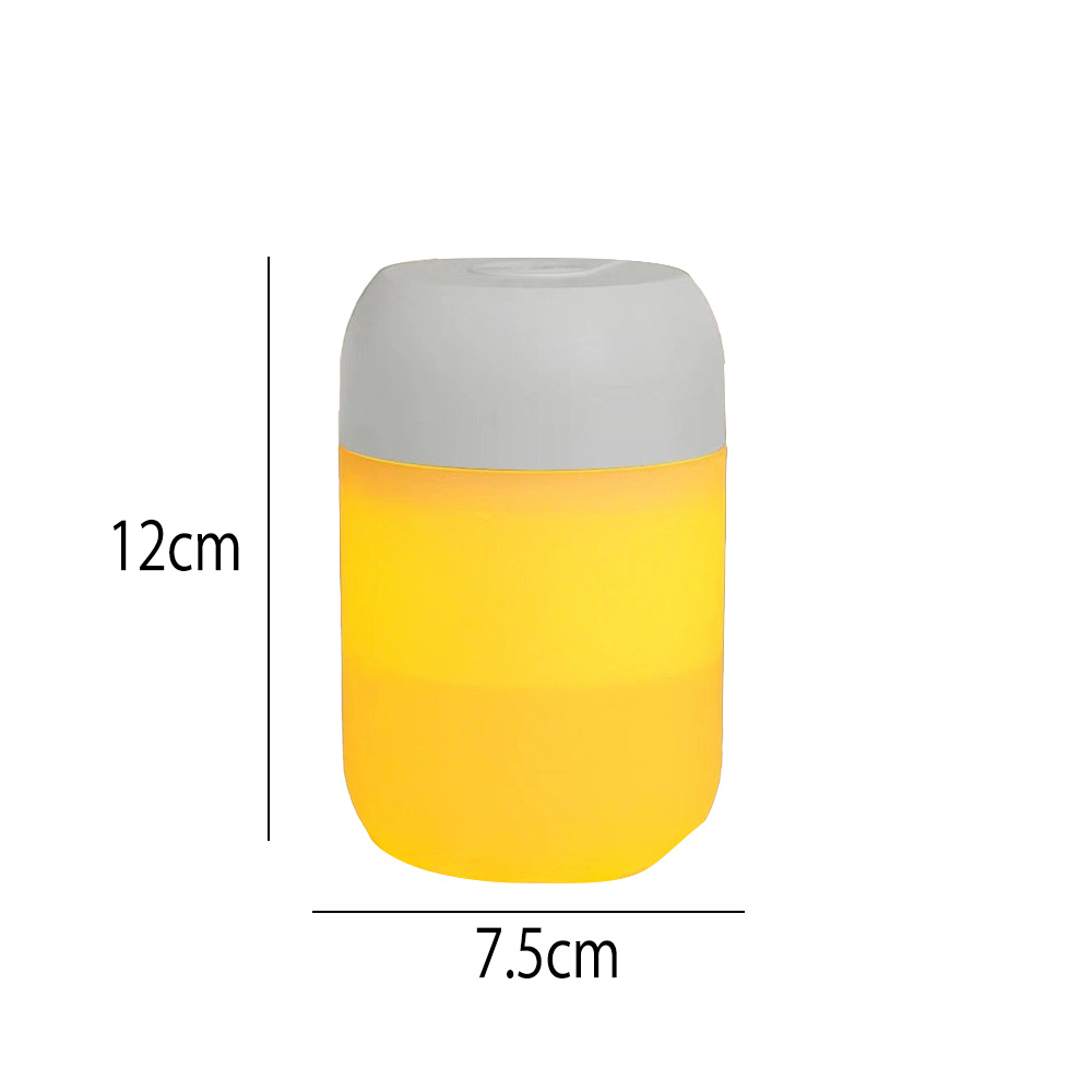 Eine zylindrische Lampe mit grauem Deckel und gelbem Körper. Maße: 12 cm hoch und 7,5 cm breit. Auf weißem Hintergrund.