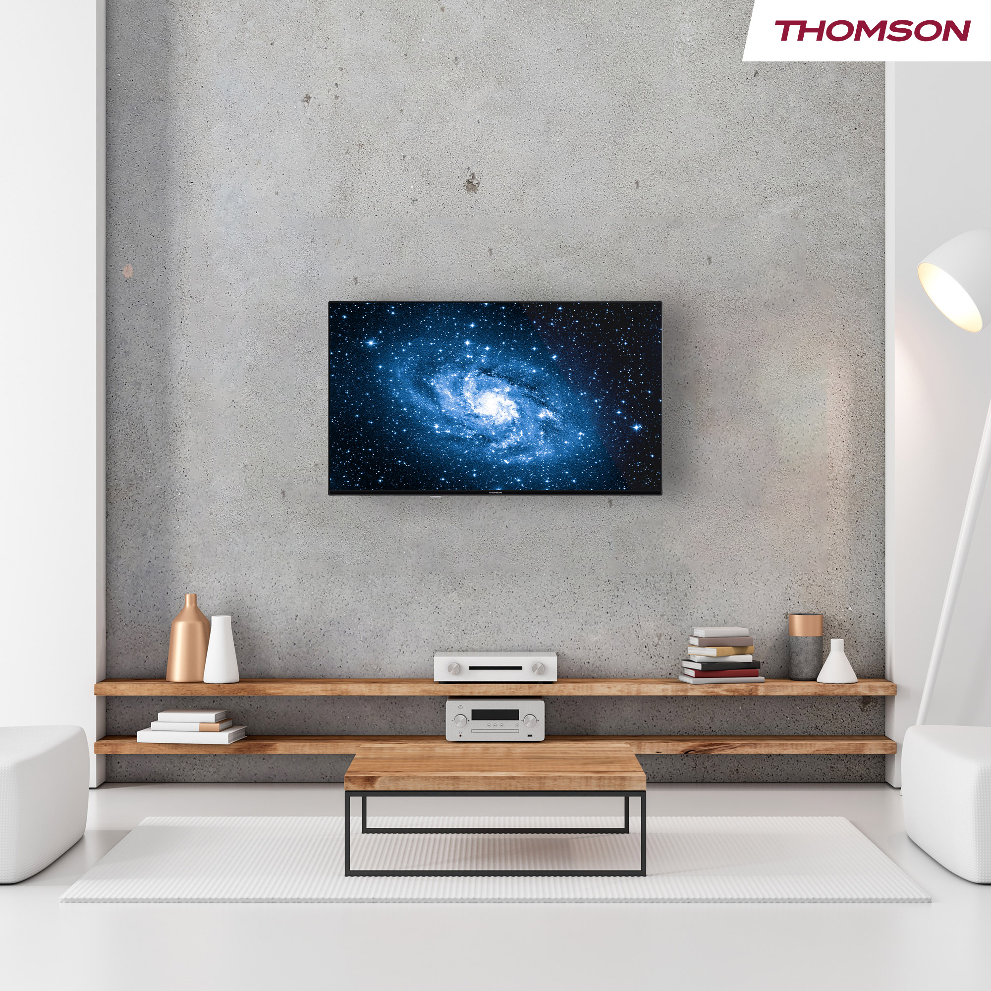 A living room with a TV displaying a galaxy. There's a wooden coffee table, shelves, and white furniture. A lamp lights the room.