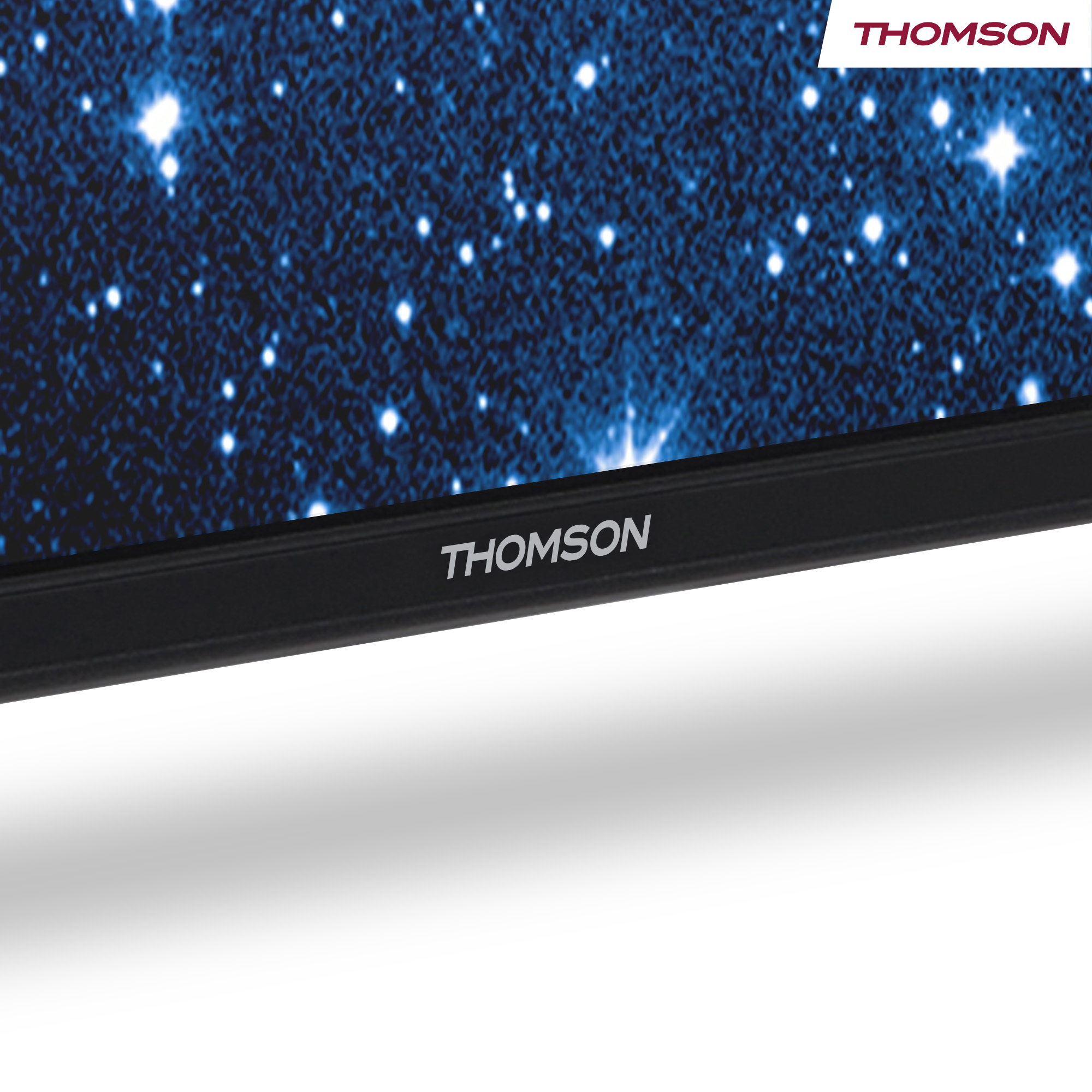 A TV screen displays a starry sky. The brand THOMSON is visible at the top and bottom of the TV.