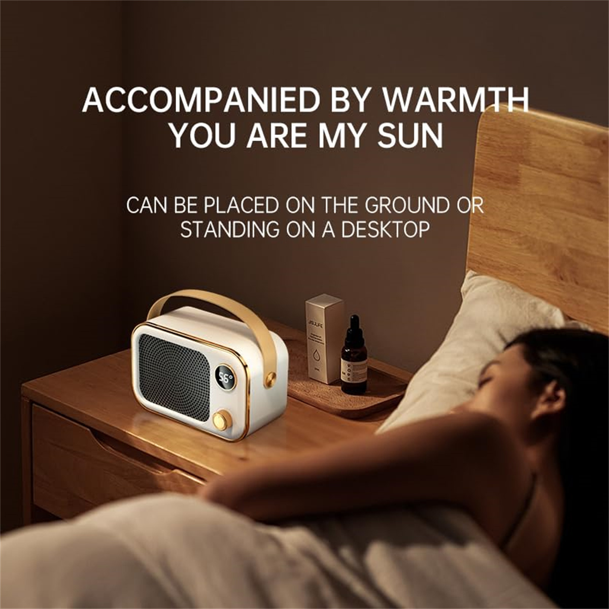 Eine Szene am Bett mit einem weißen Heizgerät. Eine schlafende Person liegt im Bett. Text auf dem Bild: begleitet von Wärme, du bist meine Sonne.