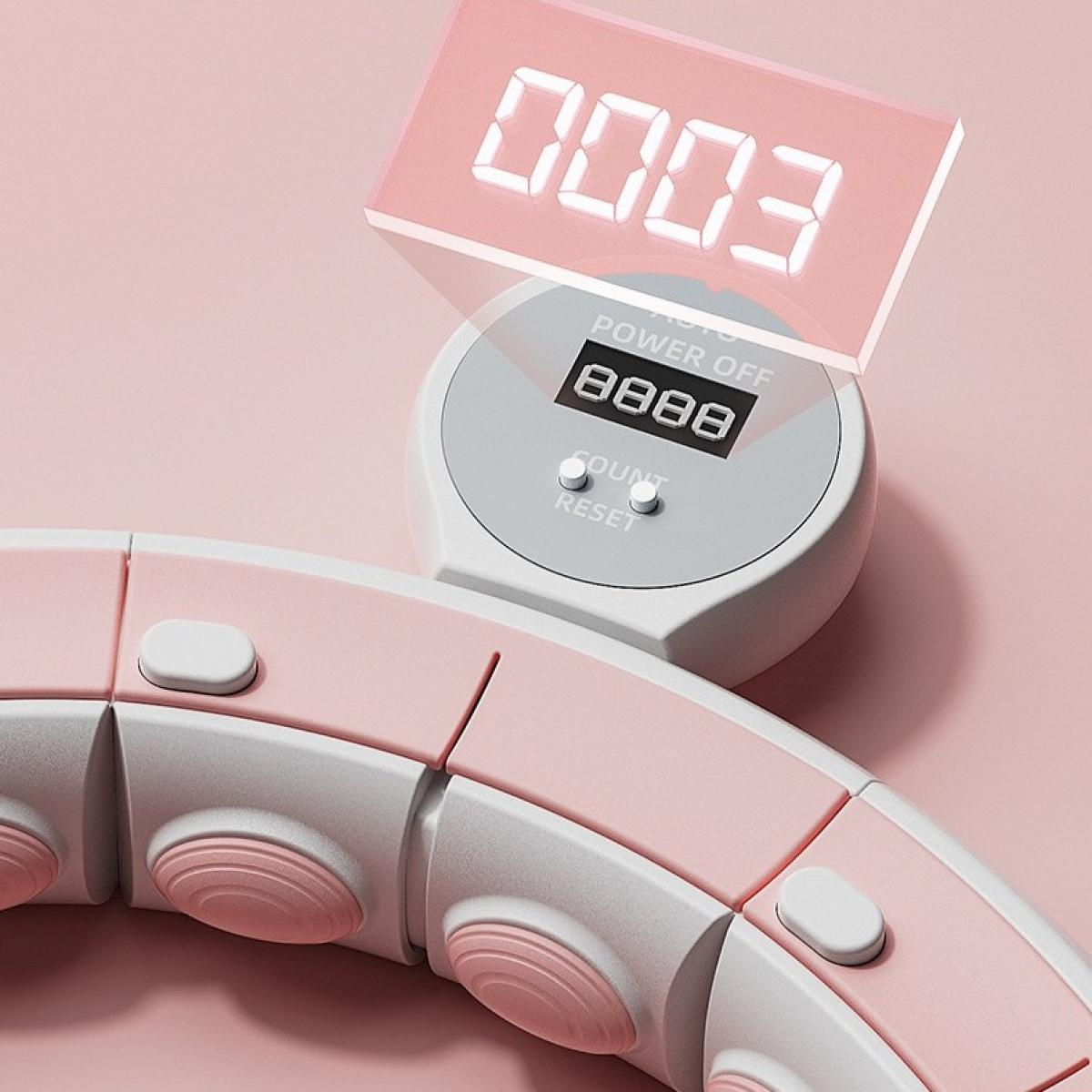 Ein rosa-weißer Fitness-Reifen mit digitalem Zähler, der '0003' anzeigt. Der Hintergrund ist ein zartes Rosa.