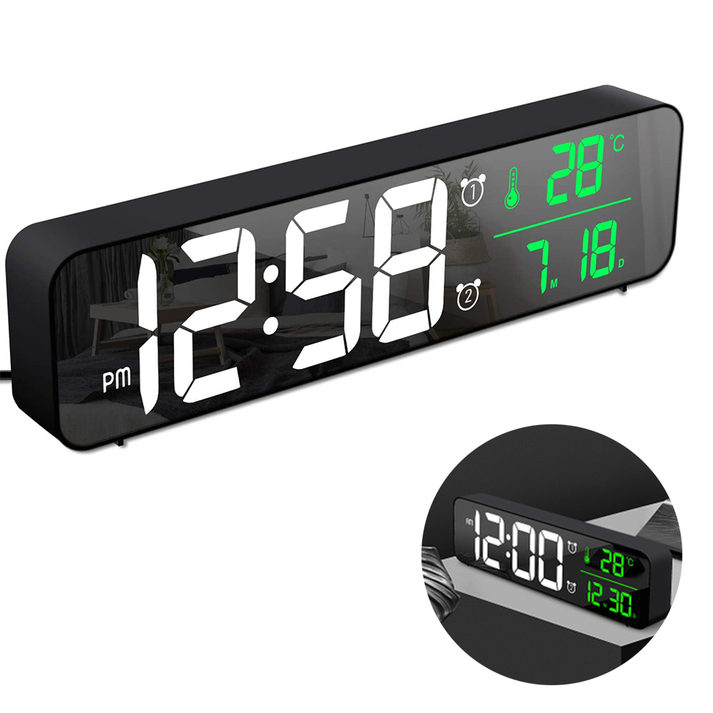 Schwarze Digitaluhr mit Anzeige von Zeit, Temperatur und Datum. Die Zeit ist 12:58 Uhr. Zeigt eine Temperatur von 28 Grad an.