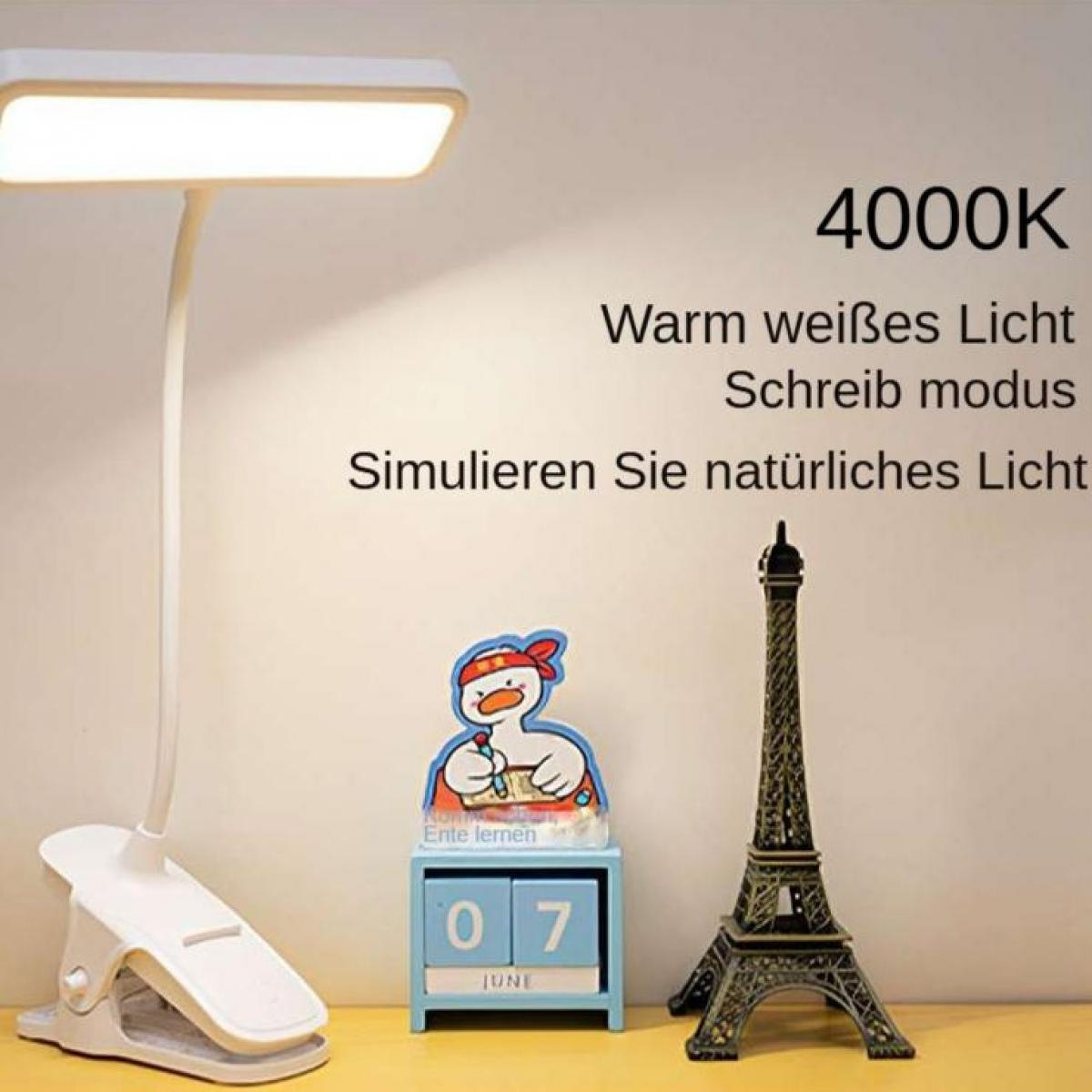 Eine Schreibtischlampe, Eiffelturm Replik und eine Entenfigur. Die Lampe ist an. Das Datum ist der 7. Juni. Text auf Deutsch ist sichtbar.