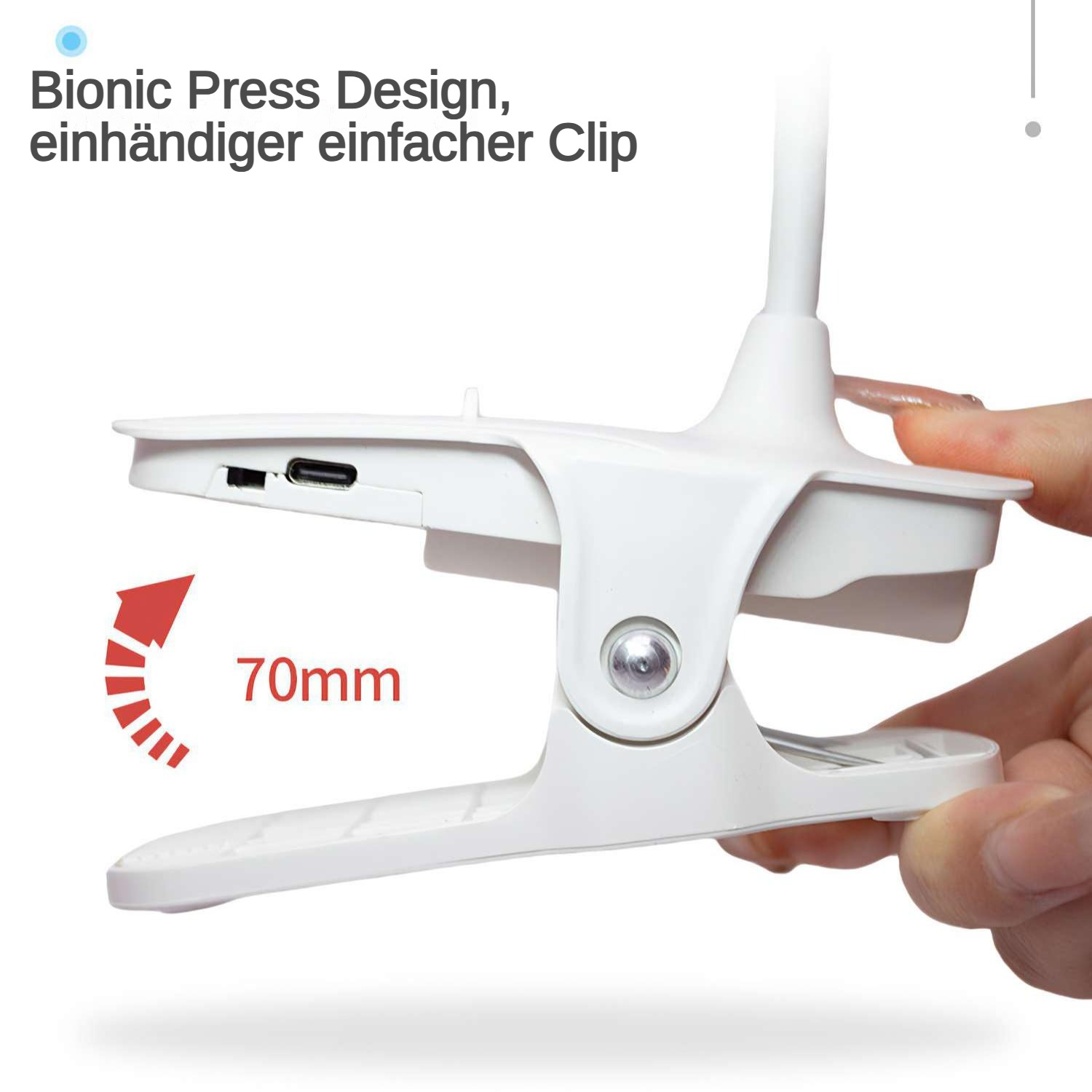 Ein weißer Clip, der von einer Hand gehalten wird. Der Text lautet 'Bionic Press Design'. Ein roter Pfeil zeigt 70 mm an.