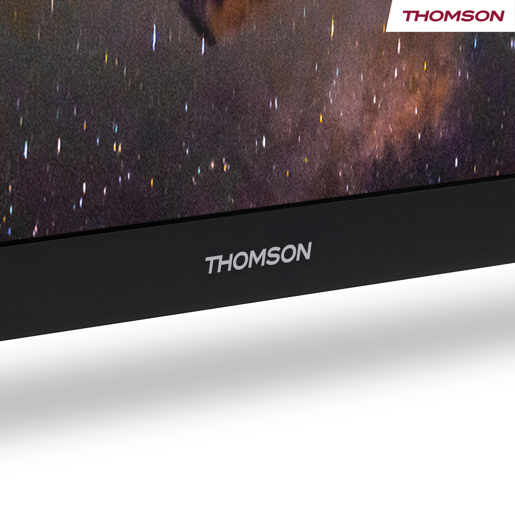Uno schermo nero mostra un'immagine della galassia. Il logo Thomson è in basso. L'angolo in alto a destra mostra il logo Thomson.