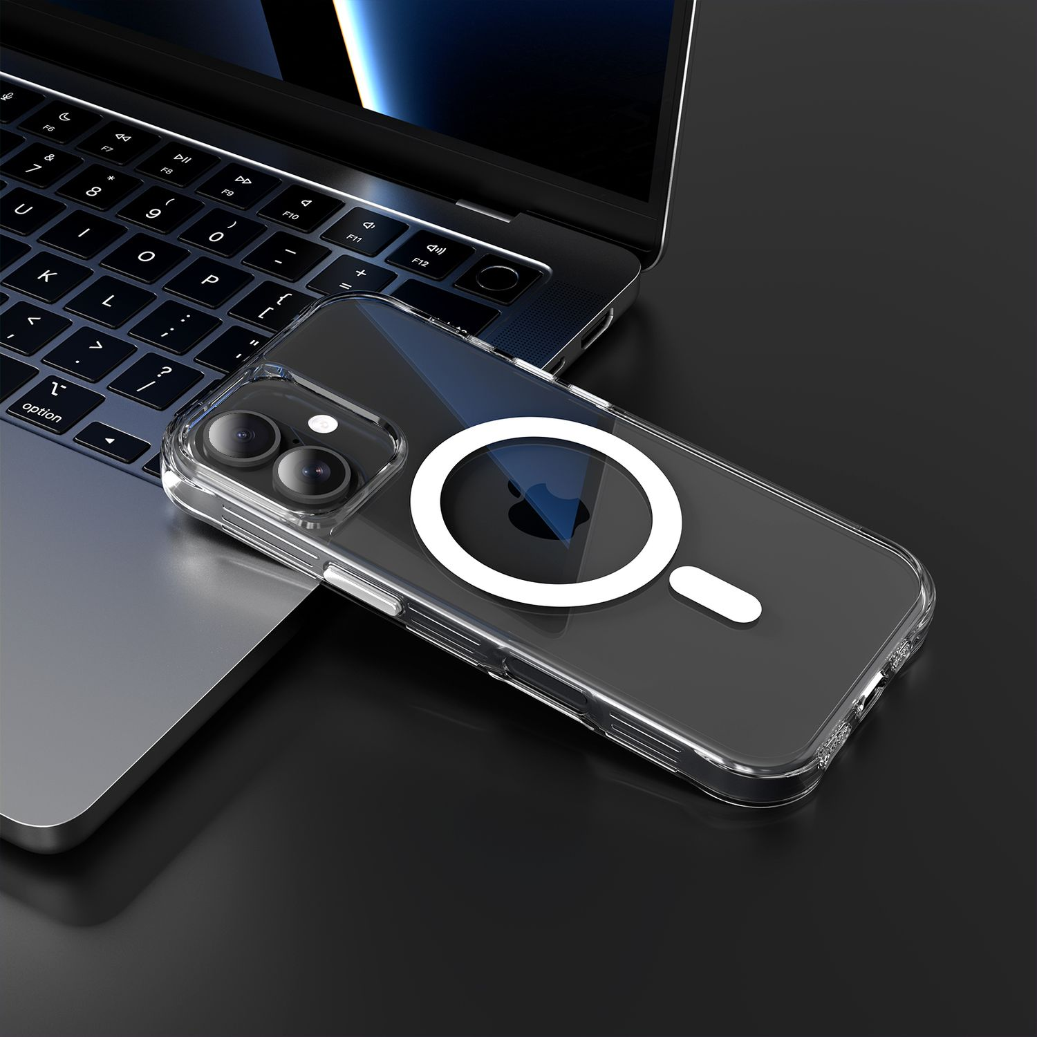 Eine transparente Handyhülle mit weißem Magnetring liegt auf einer Laptop-Tastatur. Der Hintergrund ist eine dunkle Oberfläche.