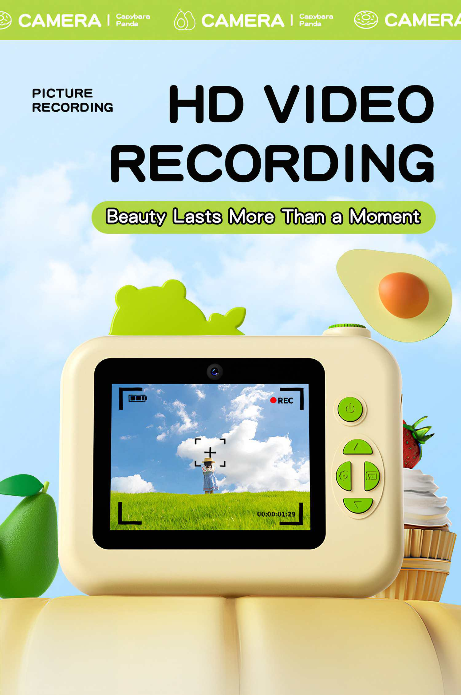 Eine Kinderkamera mit einem Bildschirm, der ein Feld zeigt, mit avocado- und erdbeerförmigen Dekorationen. Text sagt 'HD VIDEO RECORDING'.