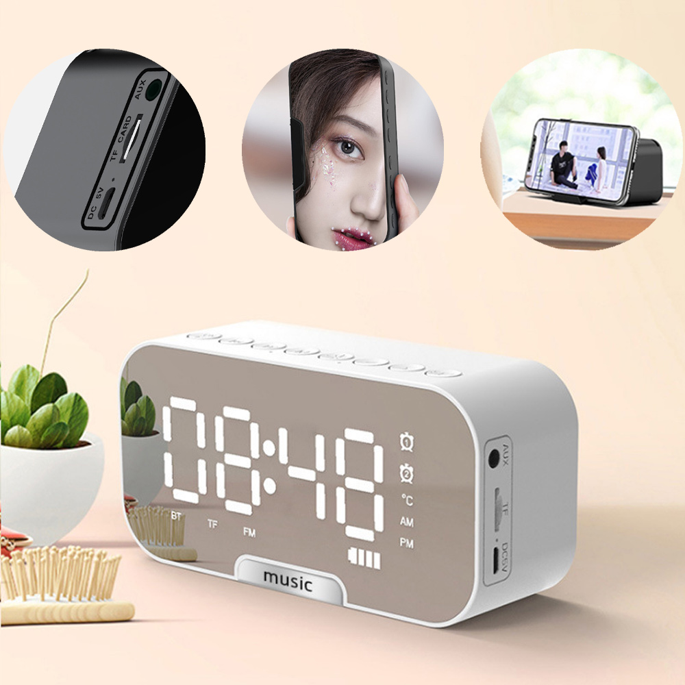 Eine weiße Digitaluhr mit Spiegelanzeige zeigt 08:48. Es gibt drei eingesetzte Bilder: ein Telefon, das ein Gesicht und ein Video anzeigt.