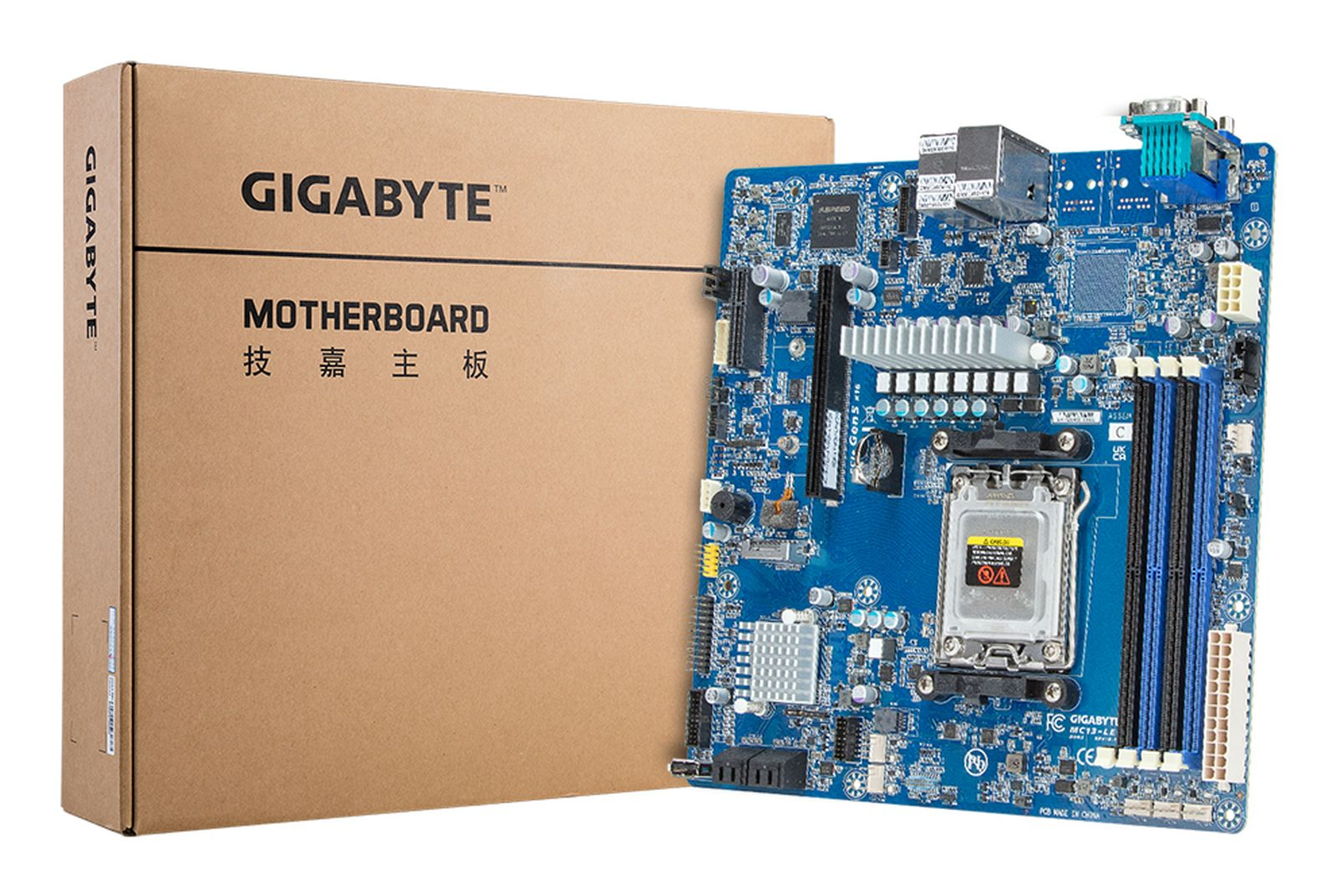 Niebieska płyta główna Gigabyte obok brązowego pudełka. Na pudełku napis 'GIGABYTE MOTHERBOARD' po angielsku i chińsku.