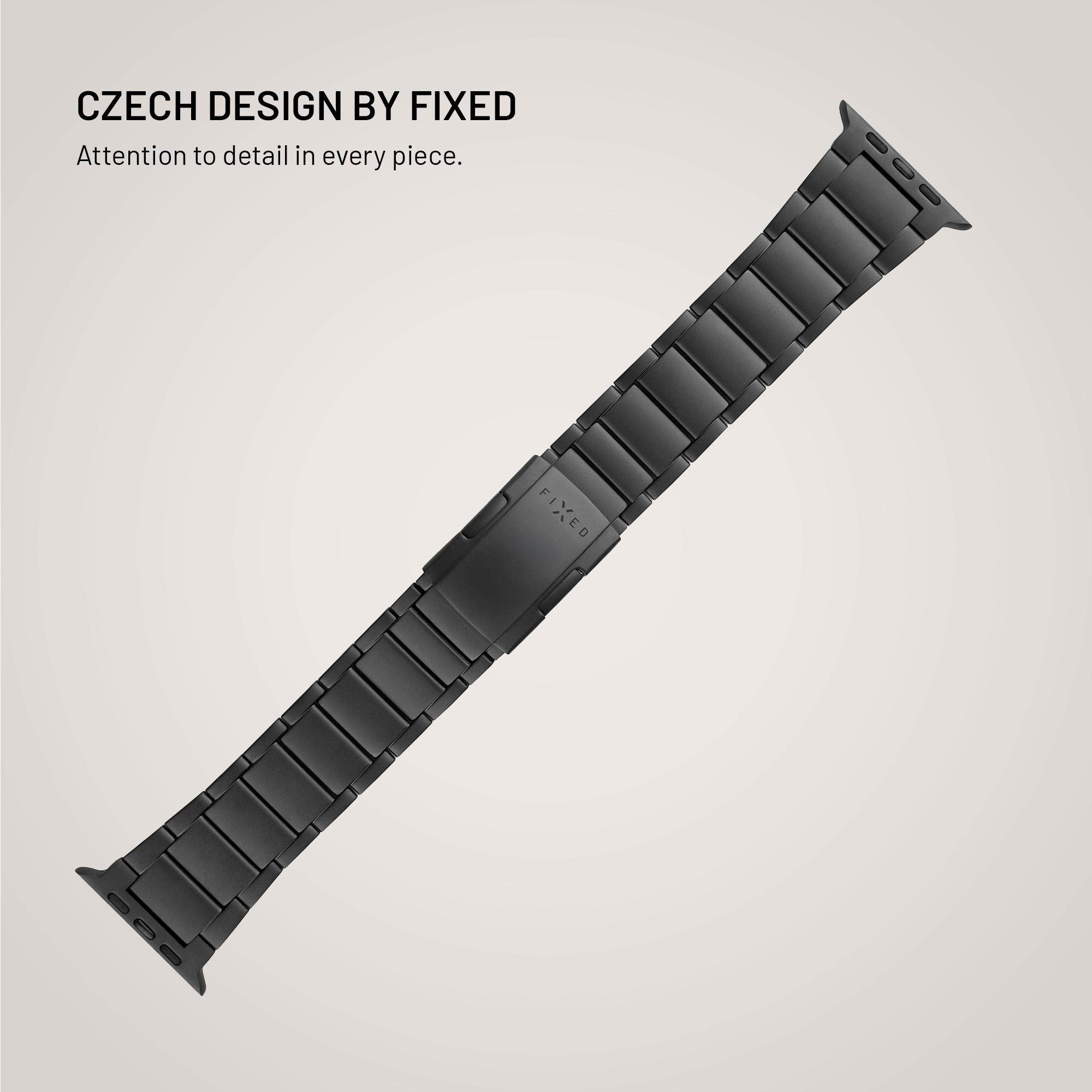 Schwarzes Uhrenarmband auf hellem Hintergrund. Darüber steht 'Czech design by Fixed'. Das Band ist schräg im Bild.