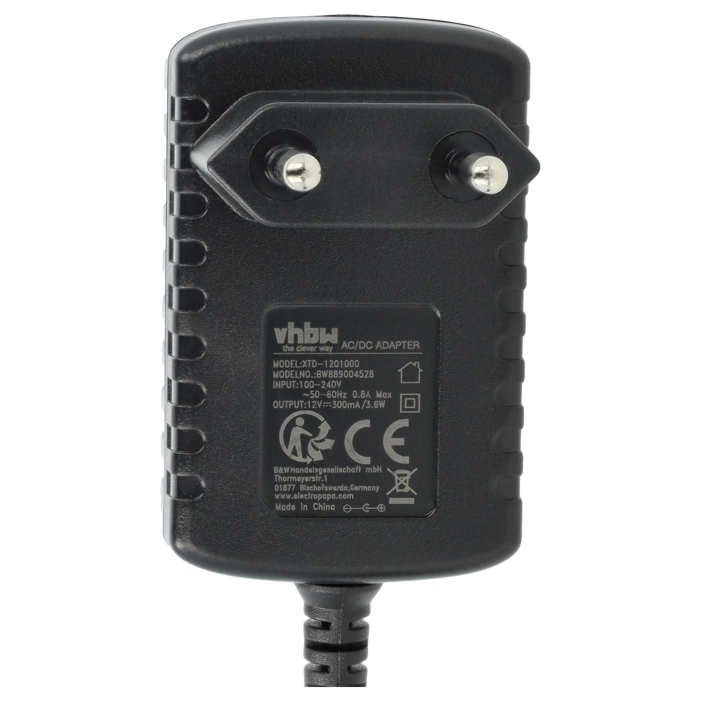 Ein schwarzer AC/DC-Adapter mit zwei Stiften. Auf der Oberfläche befinden sich weißer Text und Symbole, darunter ein CE-Zeichen.
