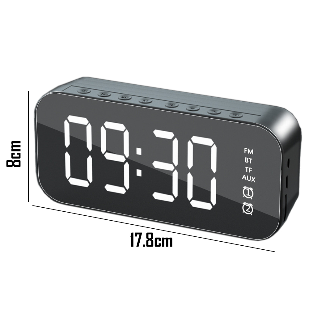 Eine Digitaluhr, die 09:30 anzeigt. Das schwarze Gerät hat Tasten oben und Funktionsanzeigen an der Seite.