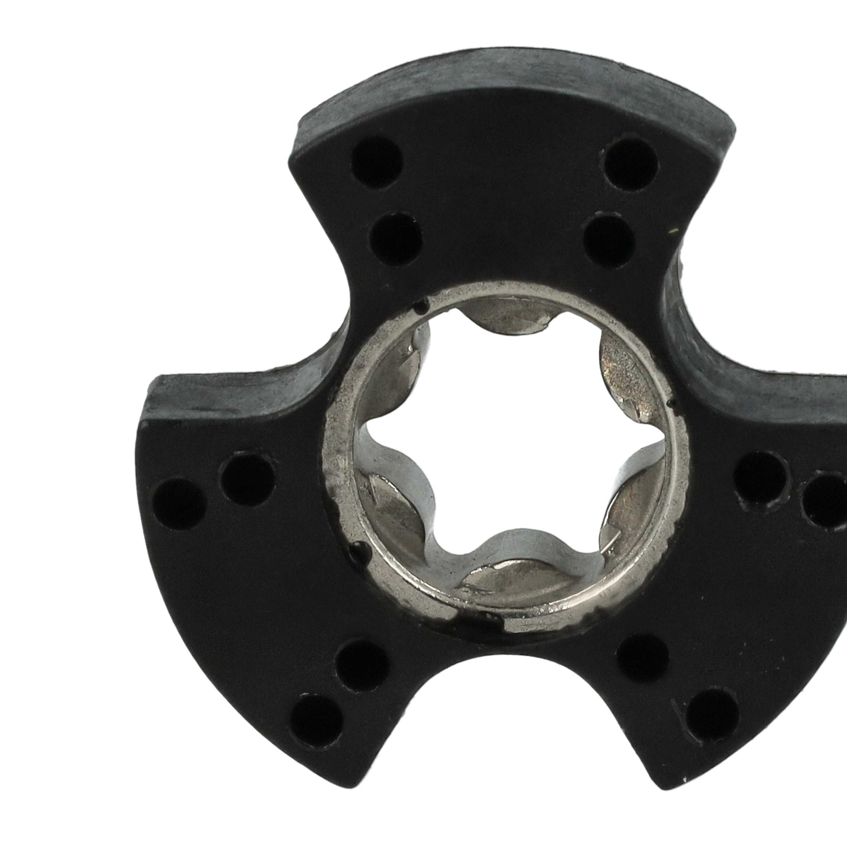 Ein schwarzes, dreilappiges Teil mit mehreren Löchern und einem zentralen Metallteil mit sternförmiger Öffnung.