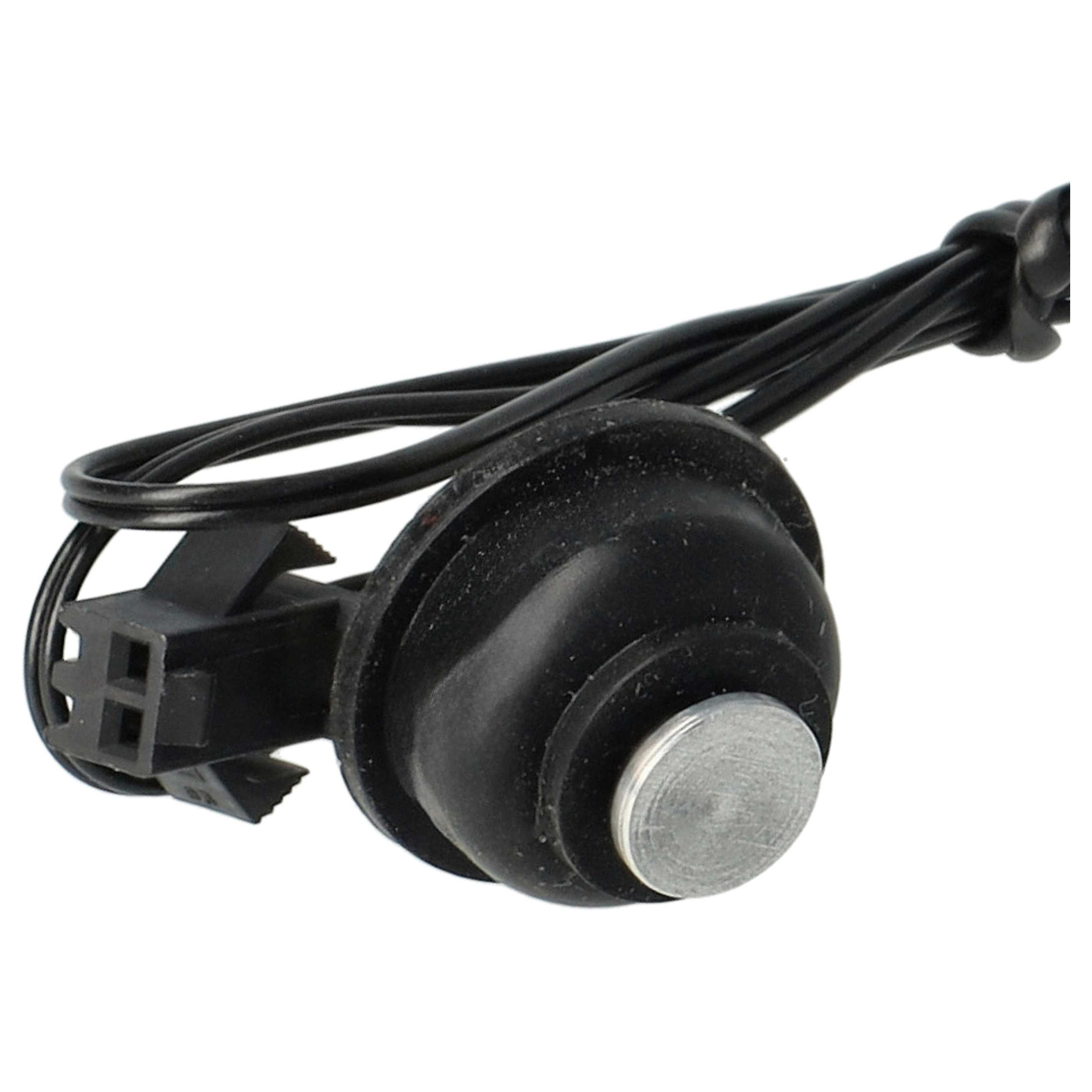 Ein schwarzer Sensor mit Metallscheibe und schwarzen Kabeln, die mit einem schwarzen Stecker verbunden sind.