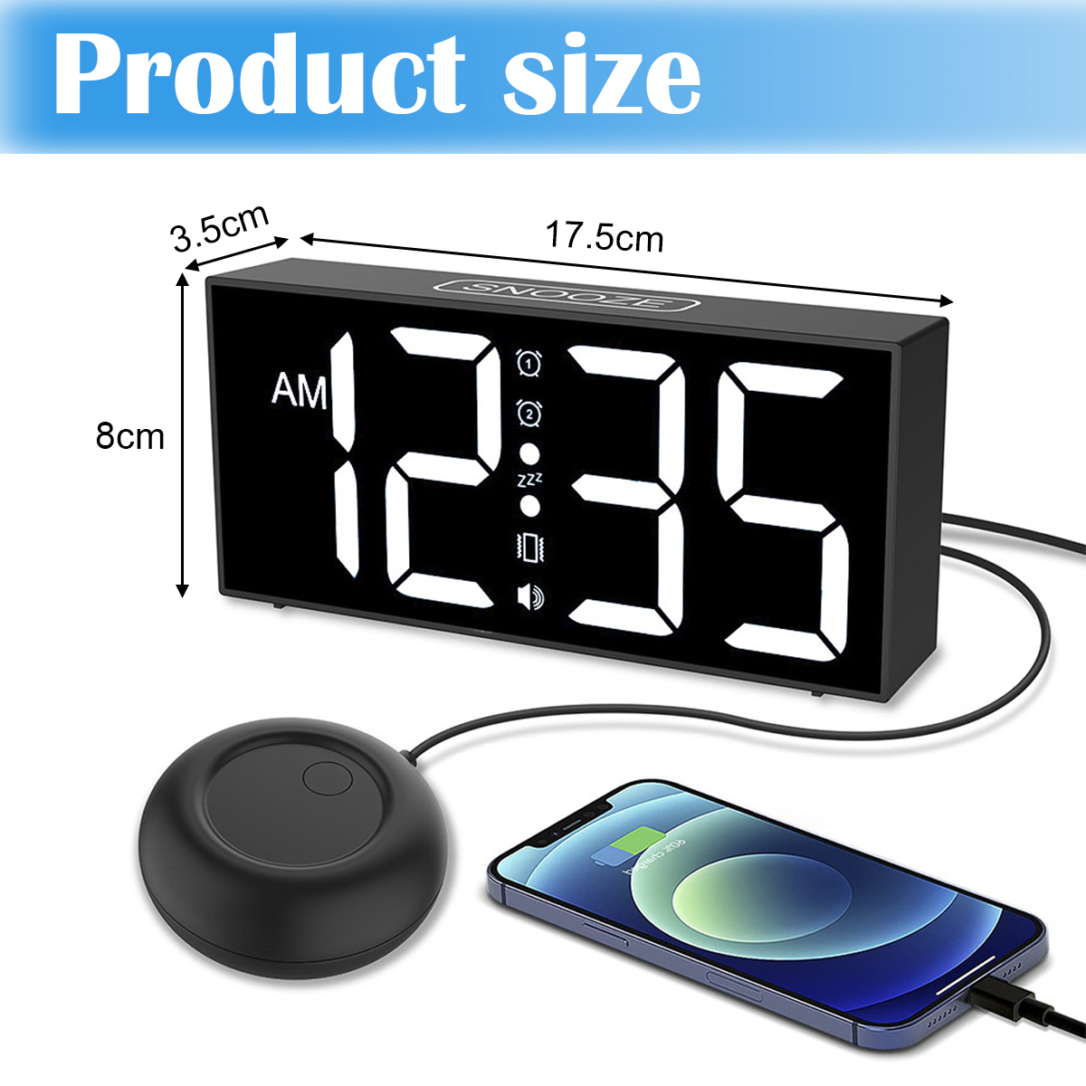 Schwarzer digitaler Wecker mit Abmessungen, einem Vibrationspad und einem ladenden Telefon. Die angezeigte Uhrzeit ist 12:35 Uhr.