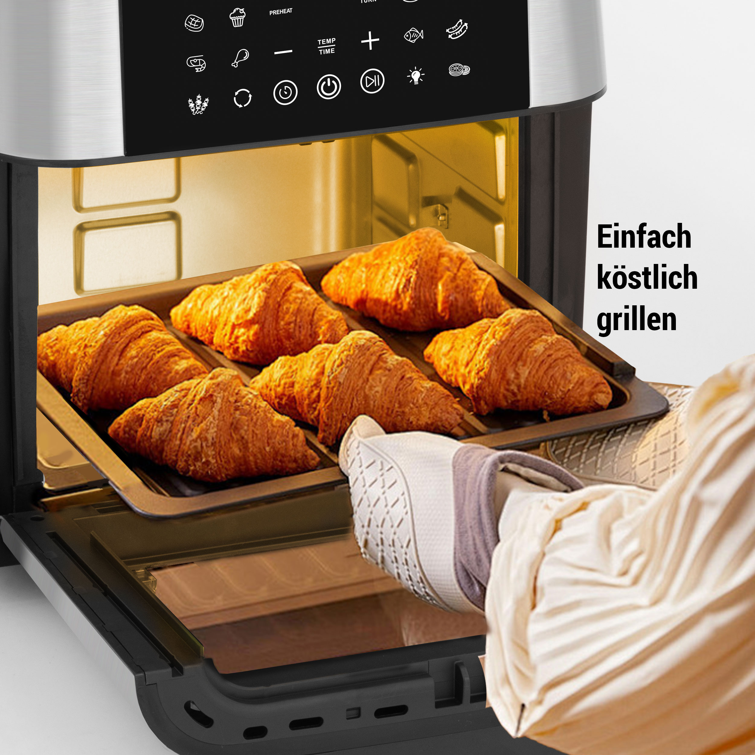 Ein Luftfritteuse mit Croissants auf einem Tablett wird von einer Person mit Ofenhandschuhen gehalten. Text: 'Einfach köstlich grillen'.