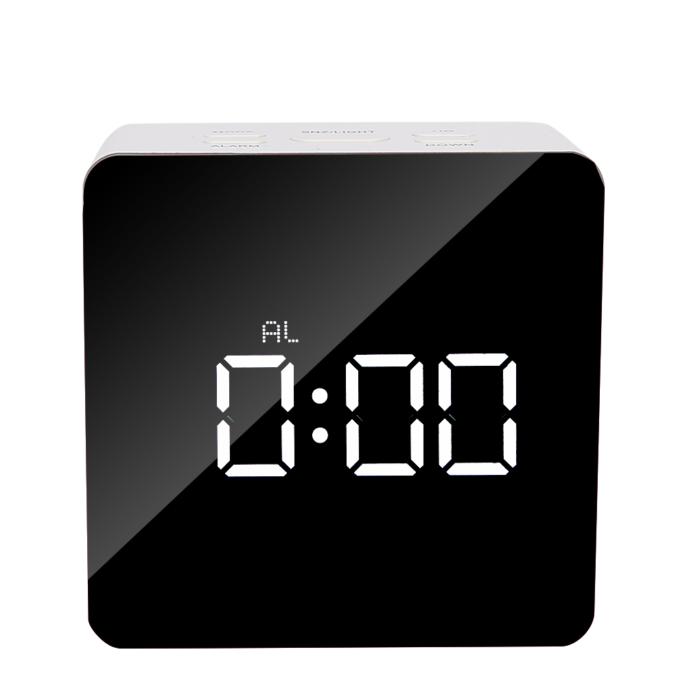 Ein digitaler Wecker, der 0:00 anzeigt. Die Uhr ist weiß mit einem schwarzen Bildschirm. Tasten oben.