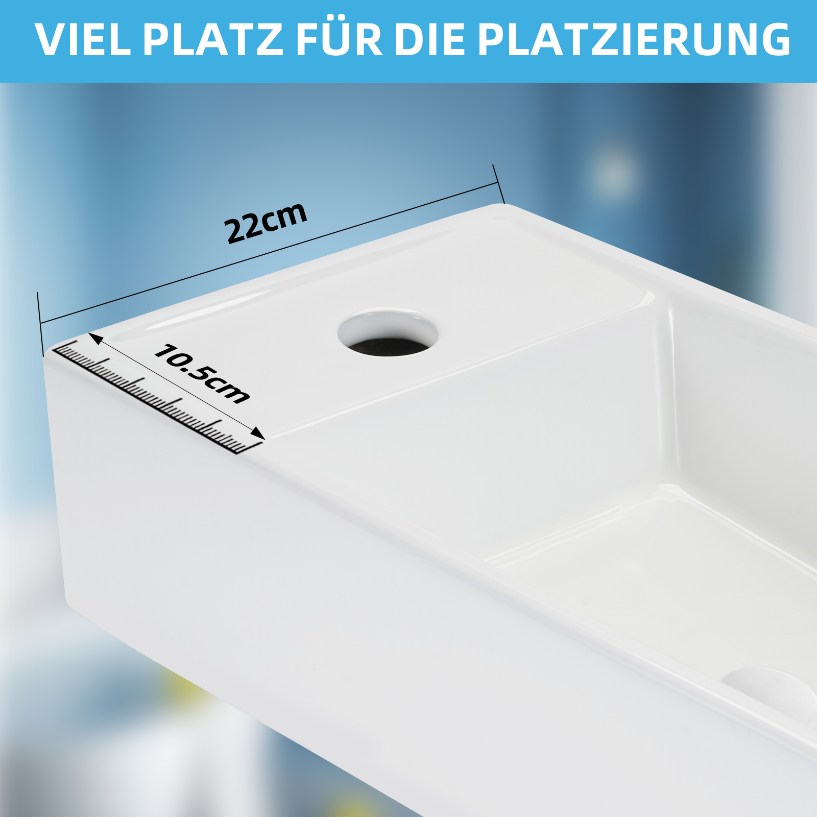 Biały zlew z wymiarami 22cm i 10,5cm. Widoczny otwór. Niebieskie i białe gradientowe tło.